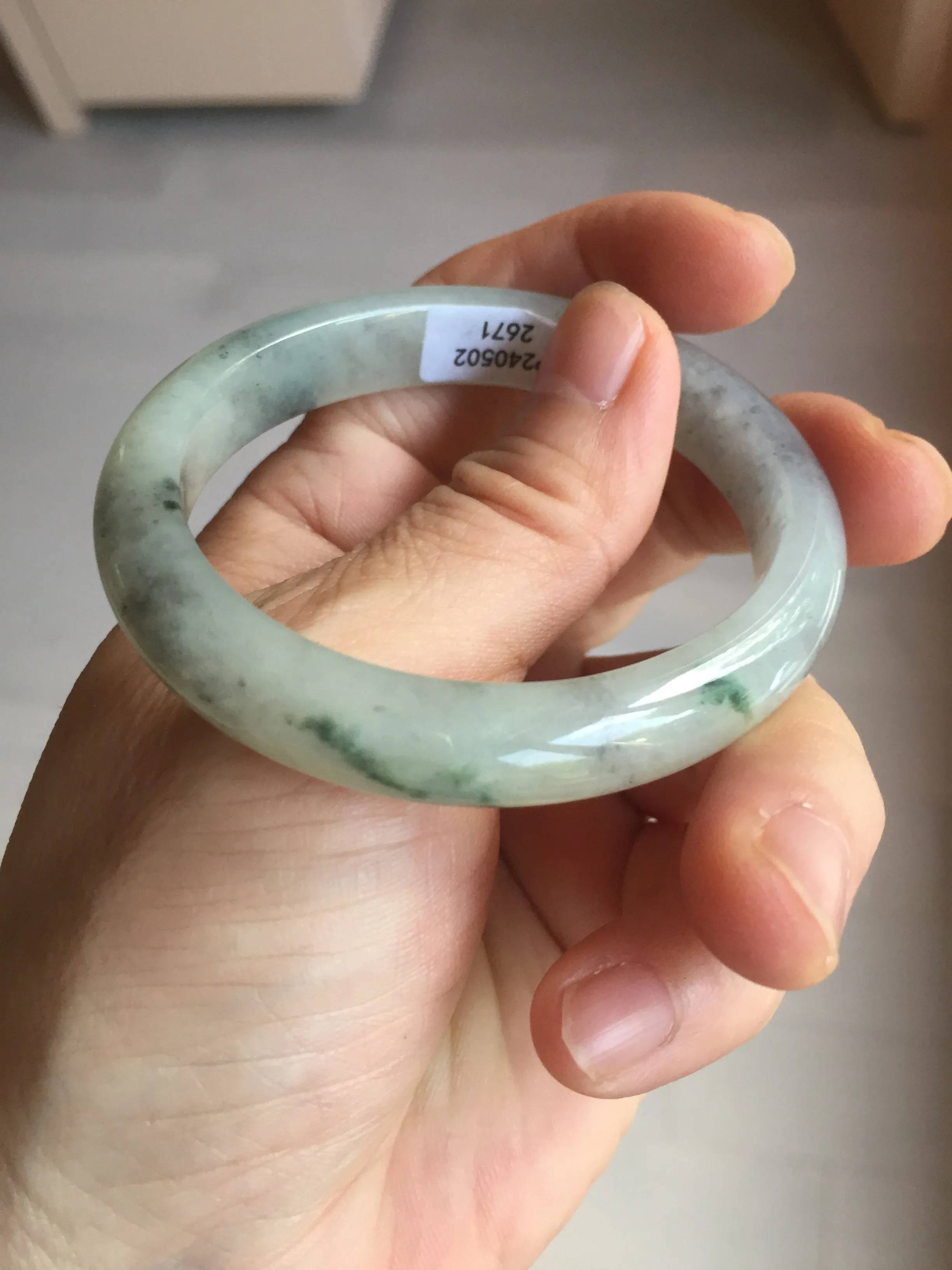 48mm Certified 100% natural Type A black/white(wuji) with flying green flowers oval jadeite jade bangle BP24-2671