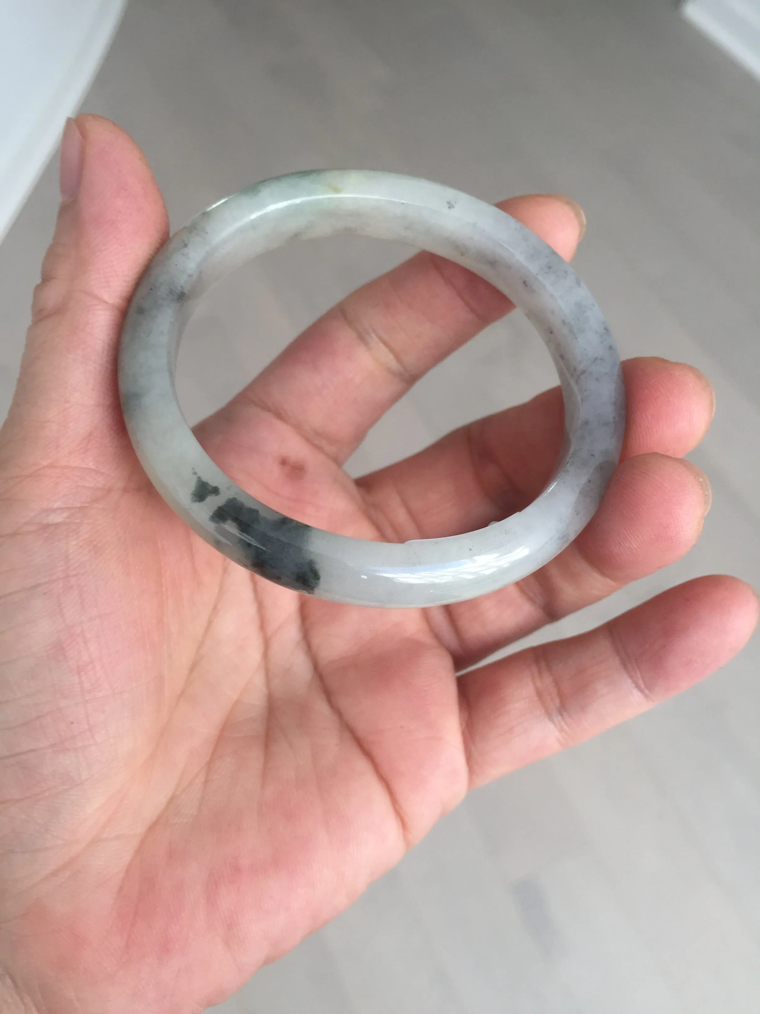48mm Certified 100% natural Type A black/white(wuji) with flying green flowers oval jadeite jade bangle BP24-2671