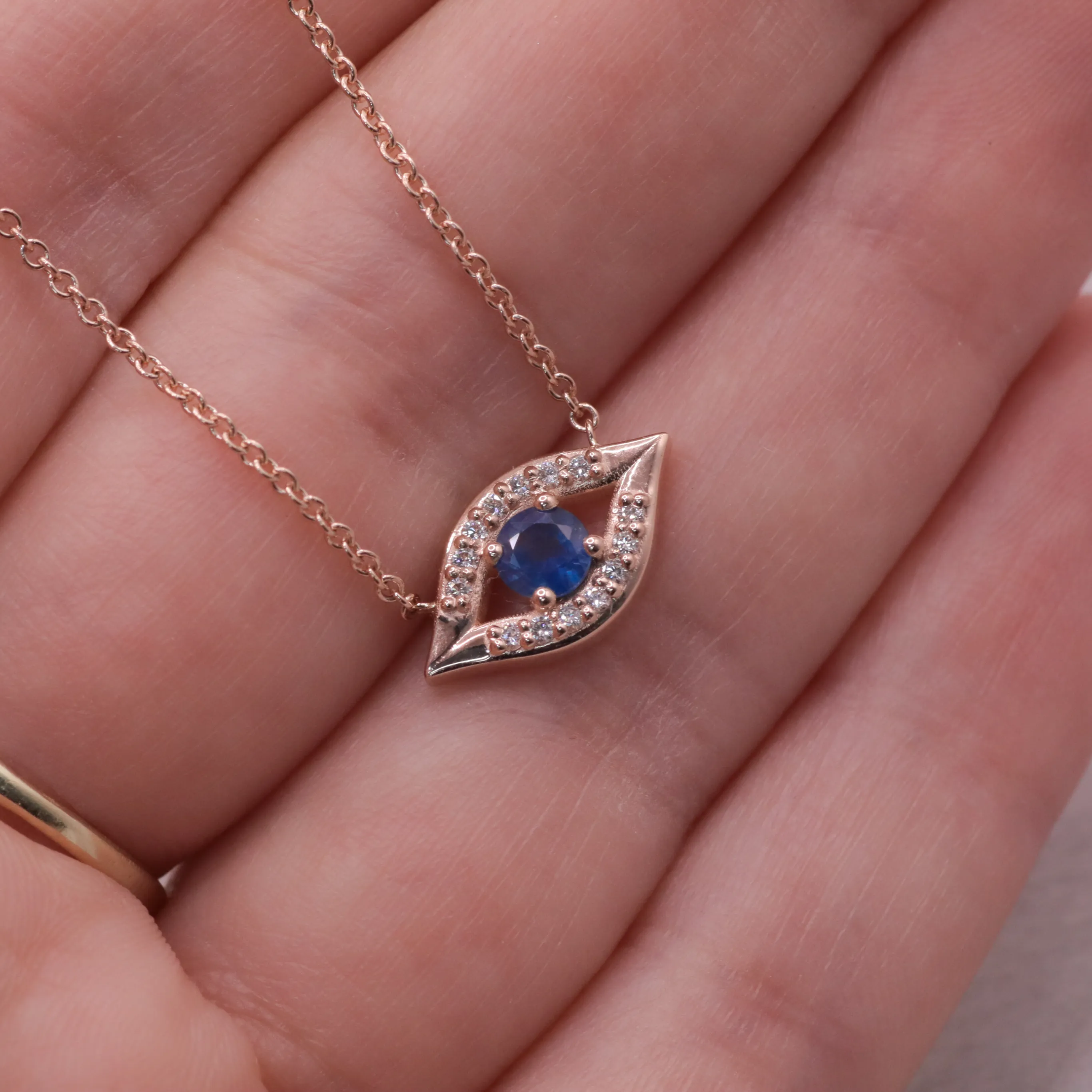 Evil Eye floating Gold Necklace Sapphire and Diamonds