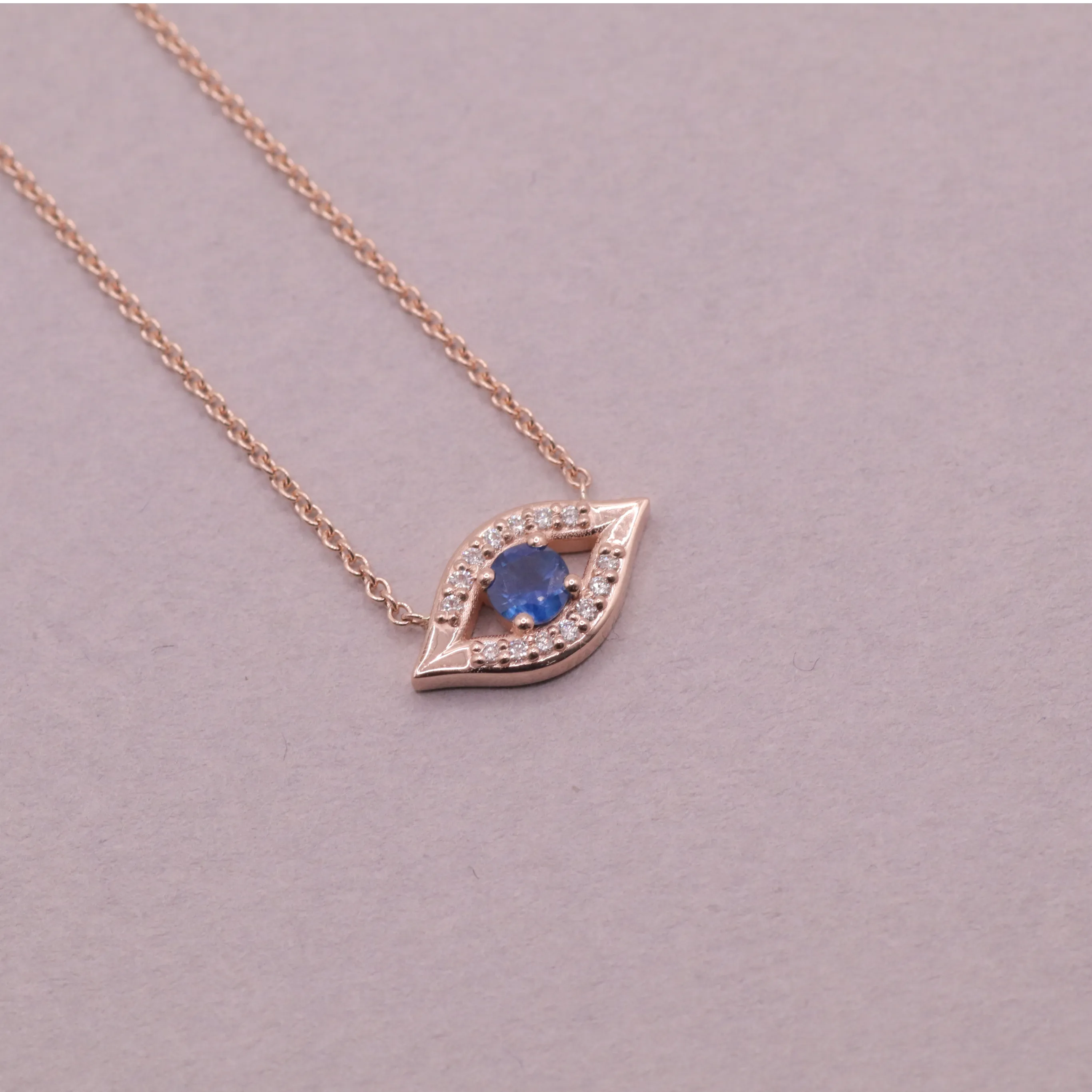 Evil Eye floating Gold Necklace Sapphire and Diamonds