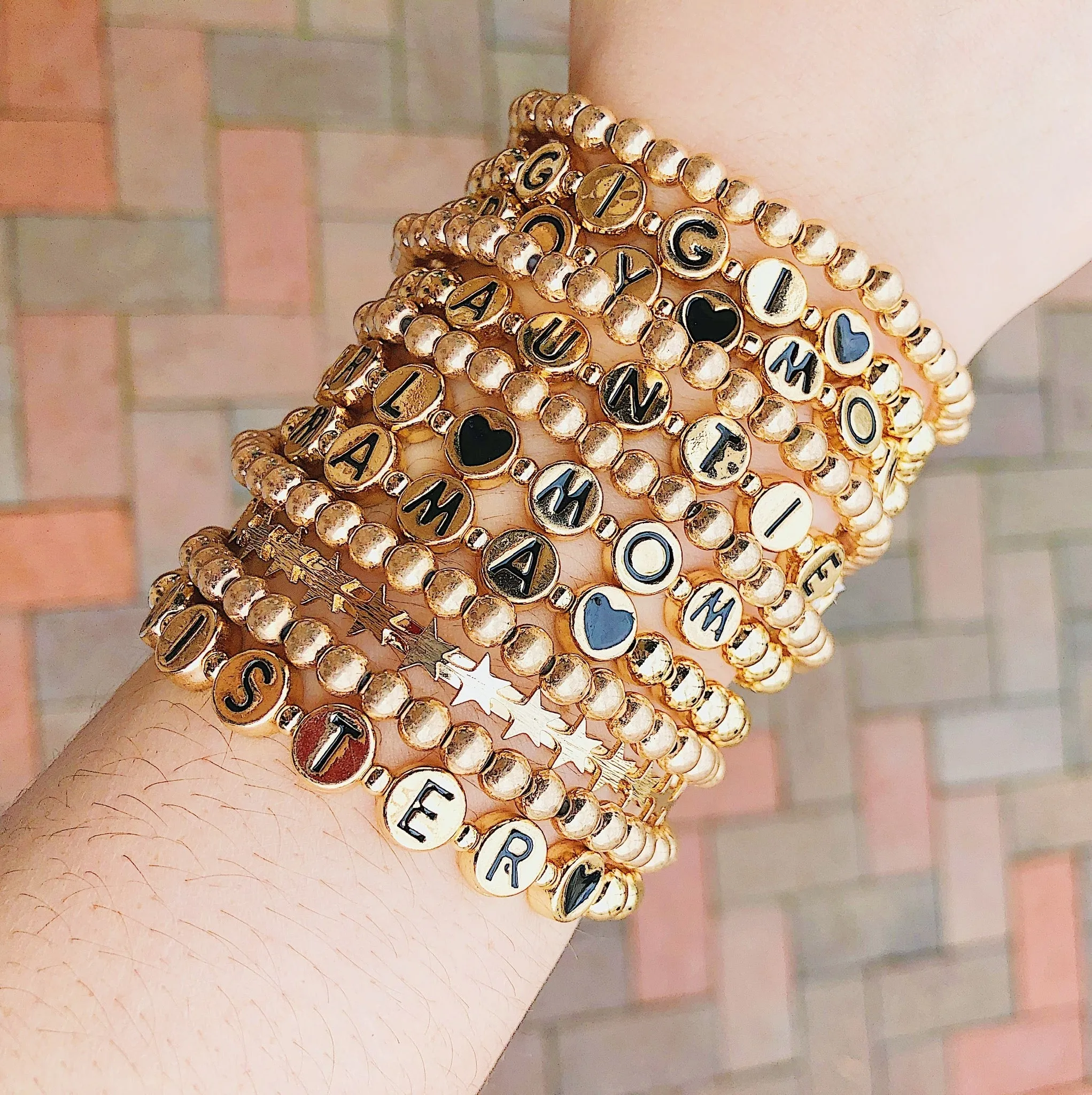 Gold Tone Ball Bead Bracelet With Black Stamped Letter Beads