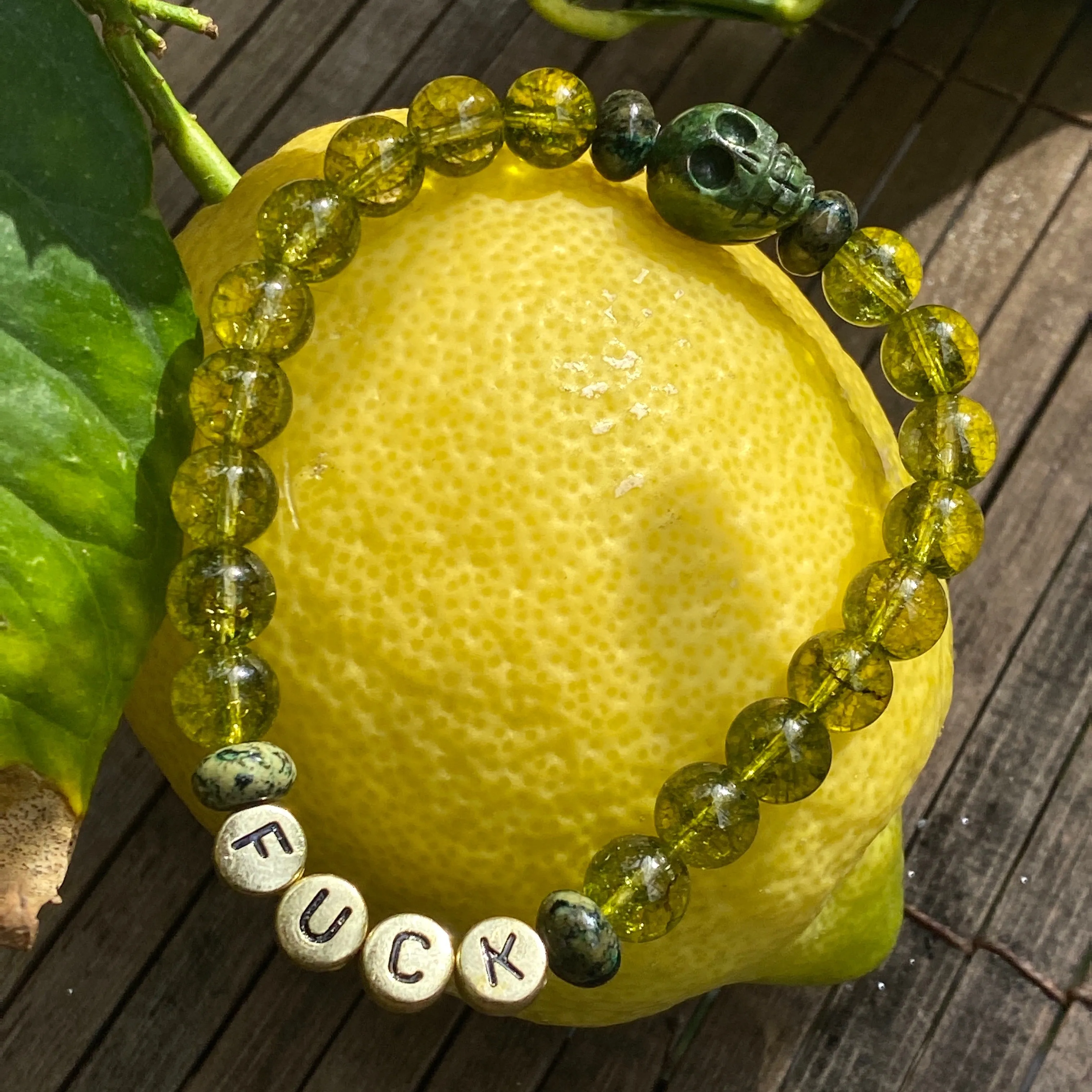 Men’s peridot, green pyrite, green Schiller sheen spar "curse" bracelet