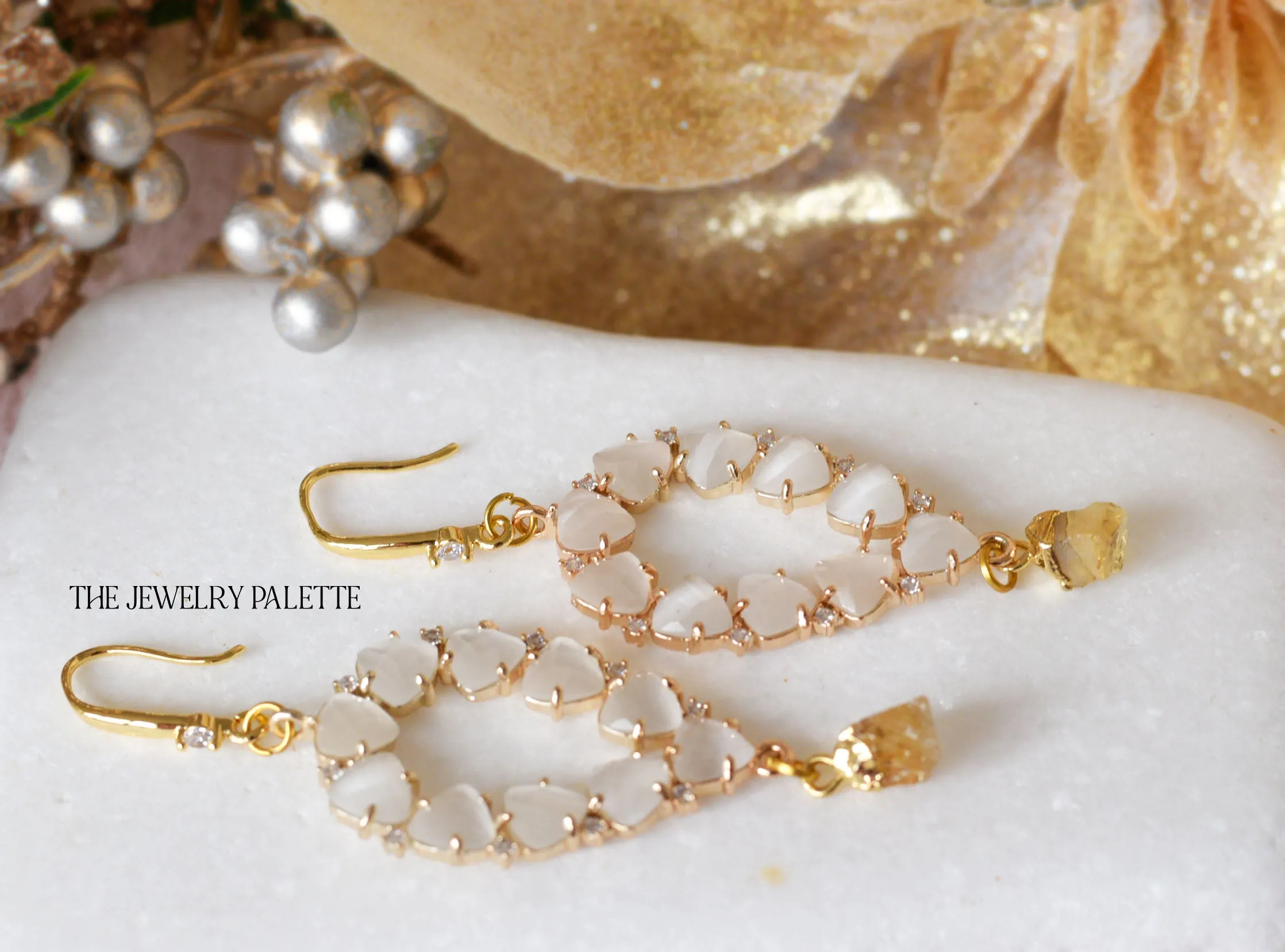 Yara white stones with gold edged ruby drop earrings